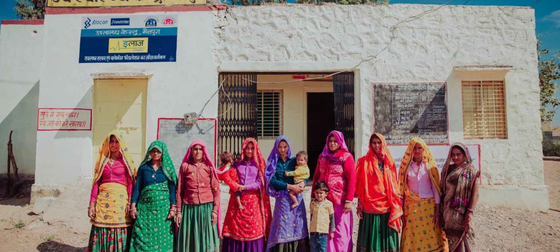 Villagers standing outside an eLAJ centre in Rajasthan, India.